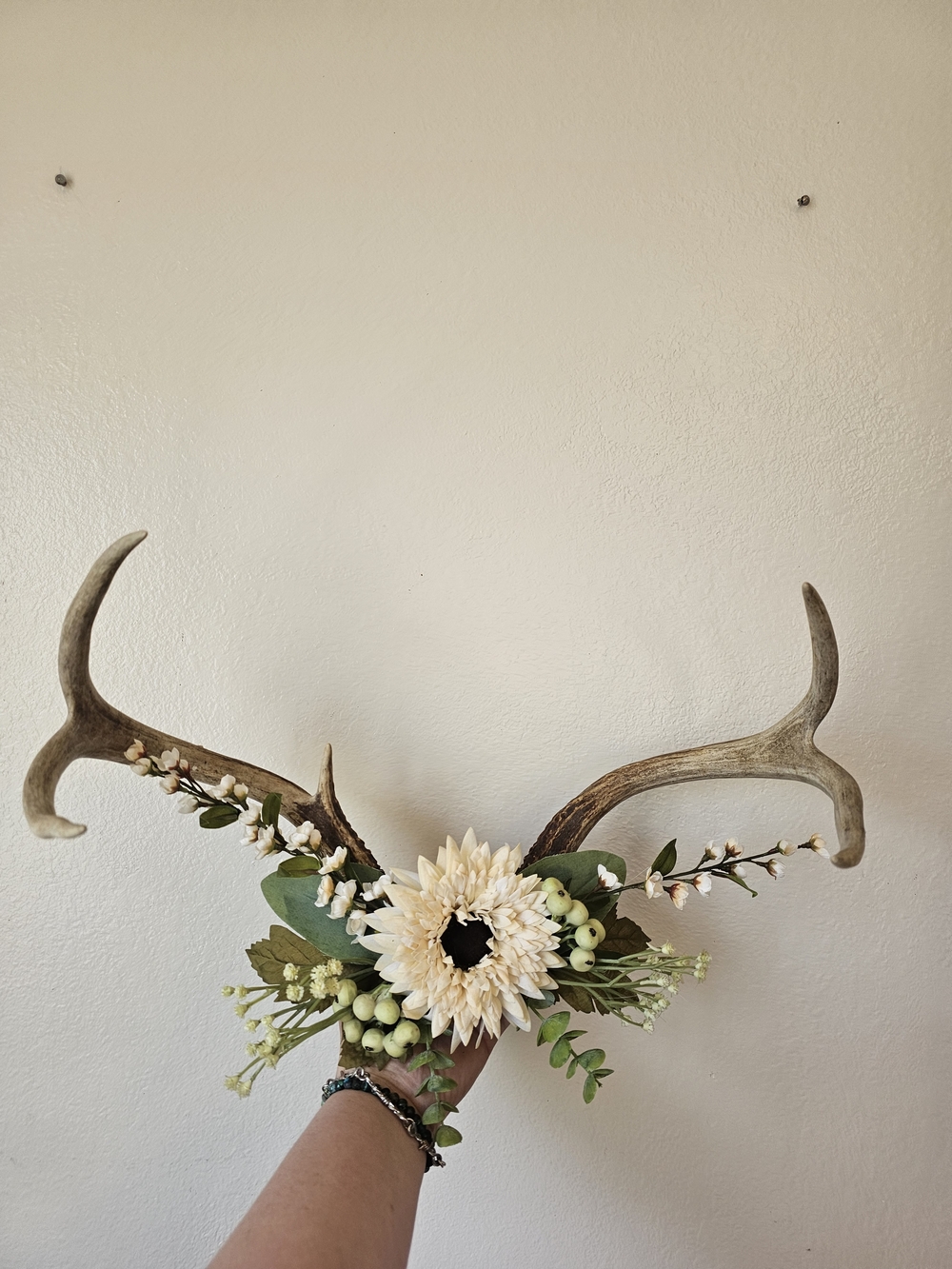 Decorative Antler Wall Accent with Cream Floral Wreath